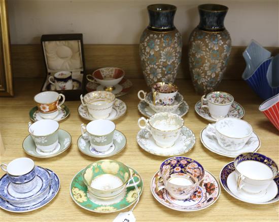 A pair of Doulton vases and a collectors cabinet